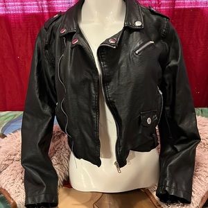 Forever Flower faux black leather moto jacket. Silver tone zippers throughout.
